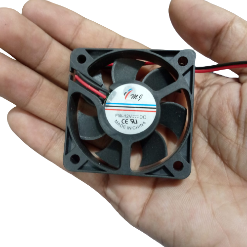 48MMX48MMX11MM 12V DC Fan - held in a hand, showing the black square frame, seven-blade impeller, and a label with FW-12V DC text and two power wires.