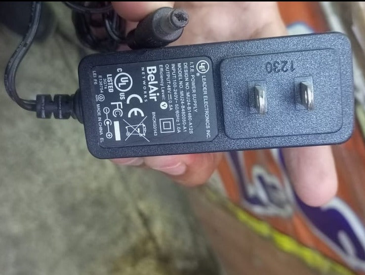 48V 0.5A Power Supply Adapter - a black wall-plug power adapter with a DC barrel connector and technical specifications printed on its surface.