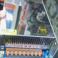 48V 20A 1000W Universal Regulated Switching Power Supply - the metal casing, AC input terminals, DC output terminals, and voltage adjustment knob.