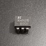 4N26 Phototransistor Optocoupler DIP-6 USED - a close-up of a black 6-pin integrated circuit component with "K4N26 8931" printed on its top surface.
