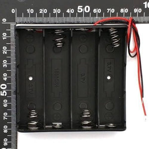 4x 18650 Battery Cell Holder Storage Box Case - shown from a top-down view with a ruler for scale, featuring four black slots and red and black wires.