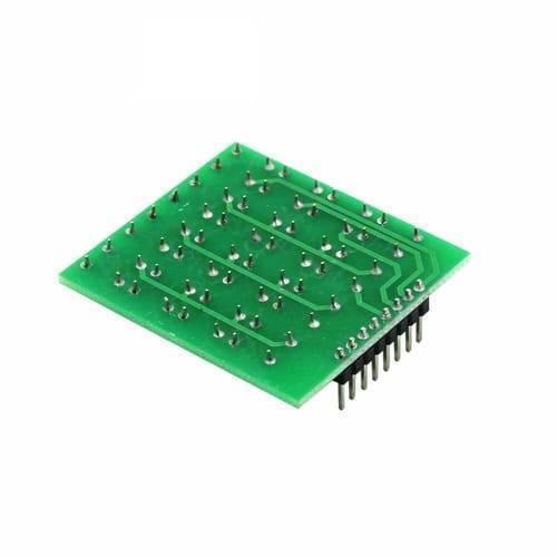 4x4 Matrix Keypad Module - the green printed circuit board underside with exposed solder points and a row of black header pins.