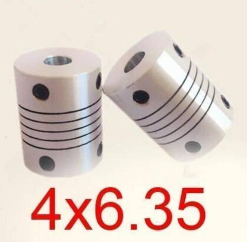 4x6.35mm Flexible Coupling Shaft - two silver cylindrical metal couplers with grooved bodies and black set screws on a plain background.