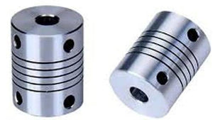 4x6.35mm Flexible Coupling Shaft - shown as two silver-coloured cylindrical metal connectors with spiral grooves and side-mounted set screw holes.