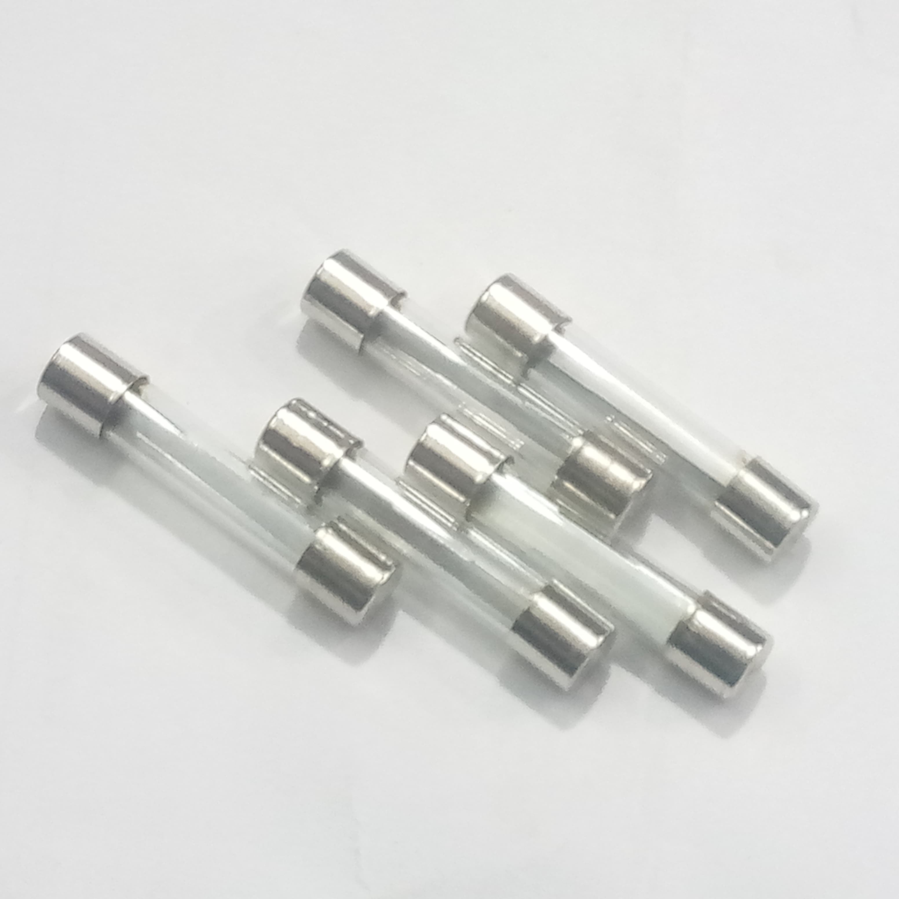 5 Pcs 6MMX21MM 35A Fuse - five cylindrical glass fuses with metal end caps arranged in a cluster against a plain white background.