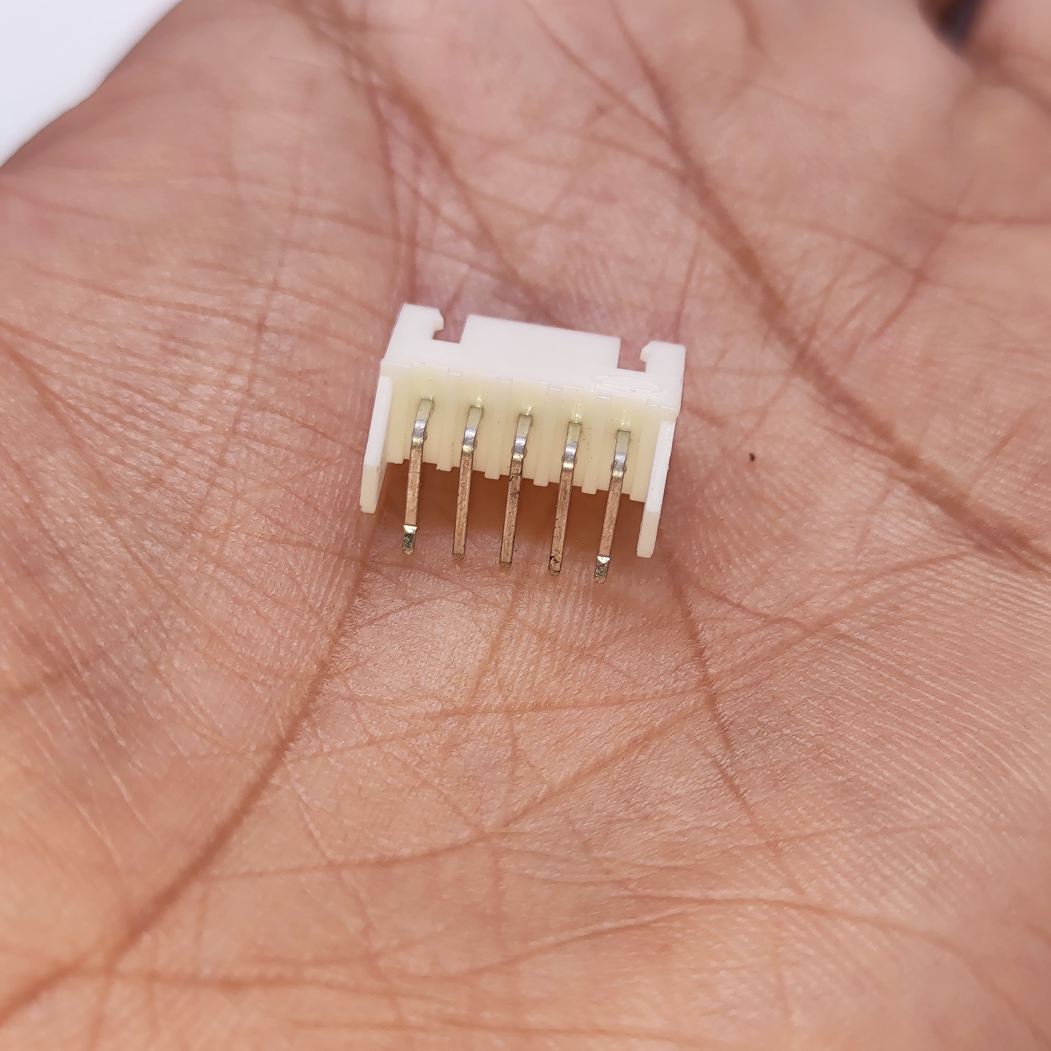 5 Pin Right Angle Male 2.5mm JST Xh Style PCB Mount Connector - shown in a close-up view, featuring a white plastic housing with five metal pins.