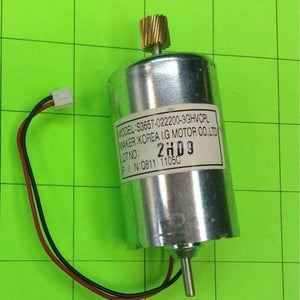 5 To 26V DC Motor Lot - a silver cylindrical DC motor with a brass gear on top, a bottom shaft, and a two-wire connector on a green grid.