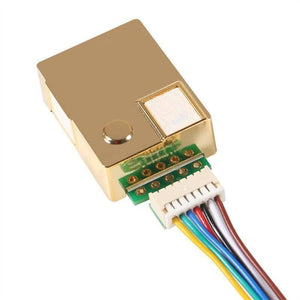 5000PPM MH-Z19B CO2 Sensor Module - shown with a gold-toned metal casing, a white connector port, and a multi-colored ribbon cable attached.