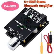 502L Module Bluetooth 5.0 Wireless Digital Amplifier Board Stereo Board 50WX2 Bluetooth Amp Price - a black circuit board with a volume knob, speaker terminals, a power input port, a screwdriver, and a power cable.