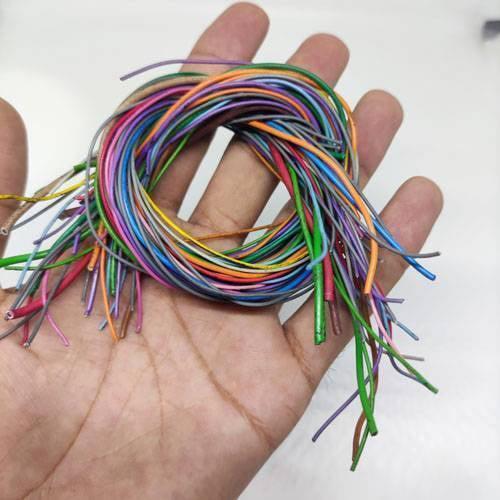 50GRM Multiple Size Flexible Wires Jumper Wire Solder Able Wires Different Colors Mix Length Used - shown as a coiled bundle of multi-colored, thin insulated wires held in a human hand.