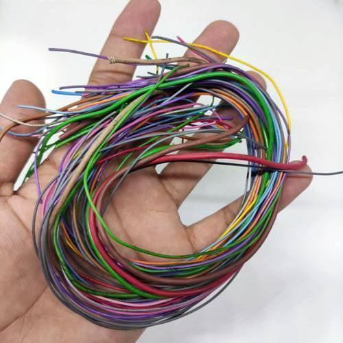 50GRM Multiple Size Flexible Wires Jumper Wire Solder Able Wires Different Colors Mix Length Used - a hand holding a tangled bundle of multi-colored, varied-length flexible wires.