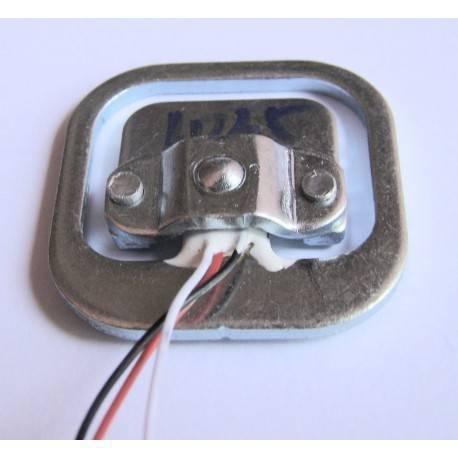 50kg Half Bridge Load Cell Sensor - a close-up of the silver metal frame with three thin wires connected to the central component.