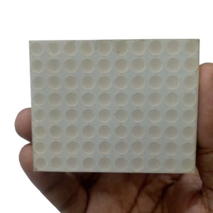 50MMX63MM 8x10 green digit Matrix - shown as a rectangular white component featuring an 8x10 grid of circular indentations held in a hand.