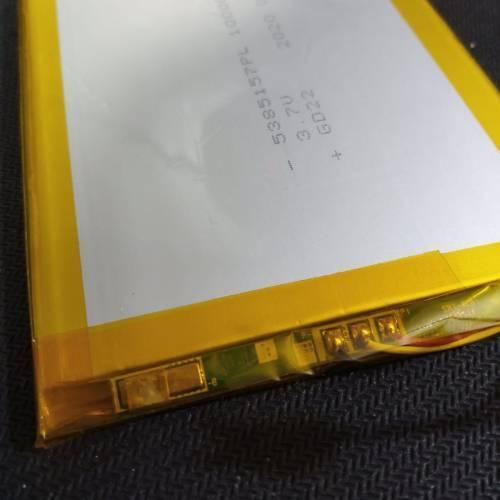 5385157PL 3.7V 10000mAh Lithium Ion Battery Stock Lot - a close-up shot showing the rectangular cell with yellow tape and the exposed green circuit board connector.