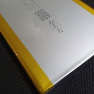 5385157PL 3.7V 10000mAh Lithium Ion Battery Stock Lot - a close-up of the silver rectangular battery surface with yellow edges and printed text including MENGYOU.