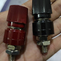 555 Black Red Terminal M8 Blocks Power Supply Terminals Welding Machine Inverter Post Connector - show one red and one black threaded post connector being held in a hand.