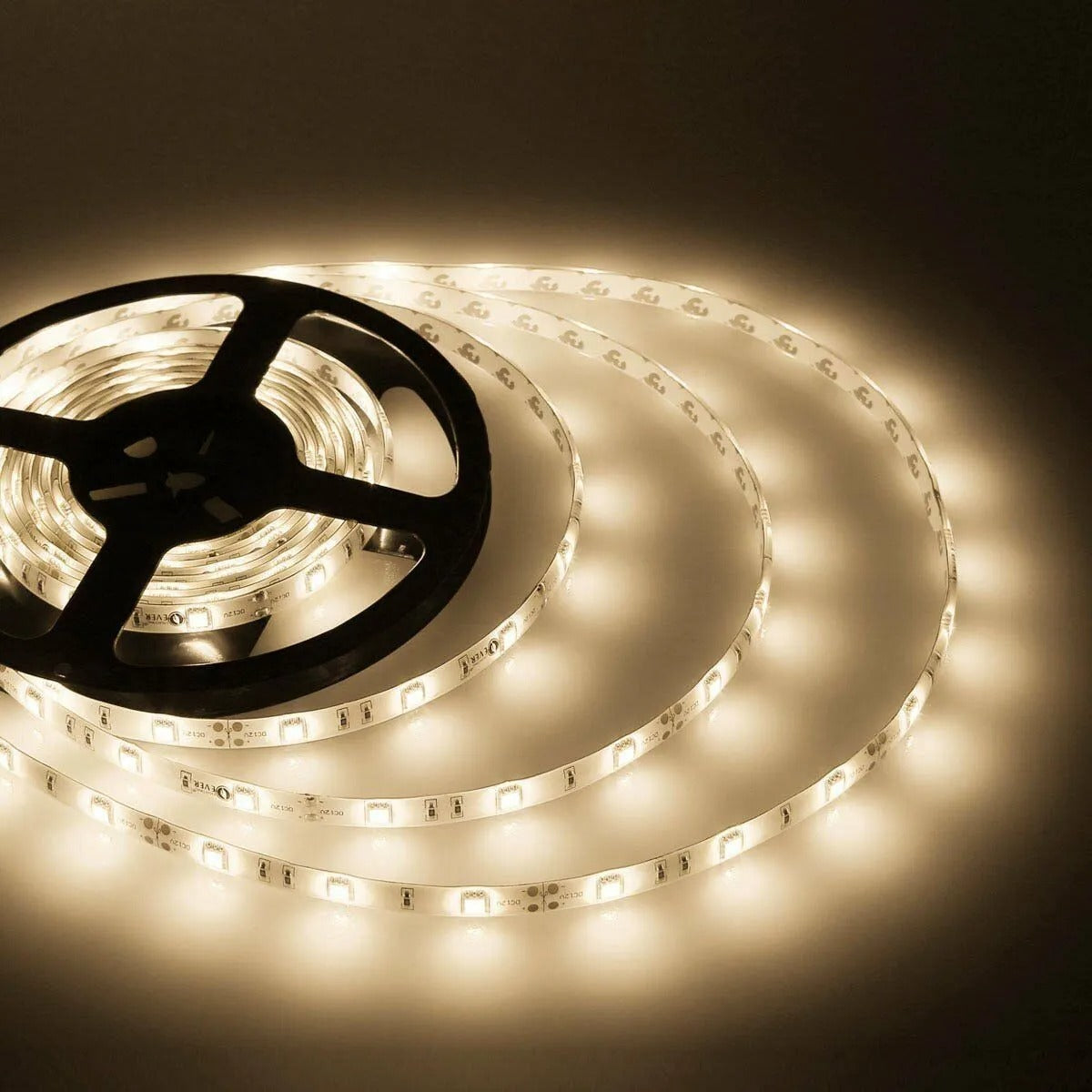 5m 5050 SMD 300 LED Warm White Waterproof Strip Lighting 12V Flexible - coiled on a black plastic spool and illuminated to emit a warm white glow.
