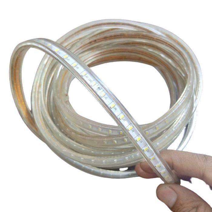 5meter White SMD Rope Light 220V - coiled into a circle and held by a hand, showing a clear plastic tube containing a series of small white LED chips.