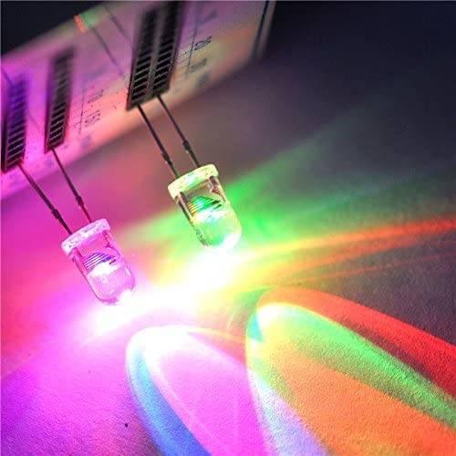5mm 7 Color RGB Automatic Rainbow Fast Flash LED - shown as two glowing, multi-coloured light-emitting diodes mounted on a white grid-patterned board.