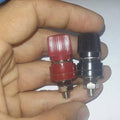 5mm Battery Terminal Stud Remote Battery Binding Post Power Junction Connector Terminal Kit 1 Pair Black + Red - one red and one black post held in a hand.