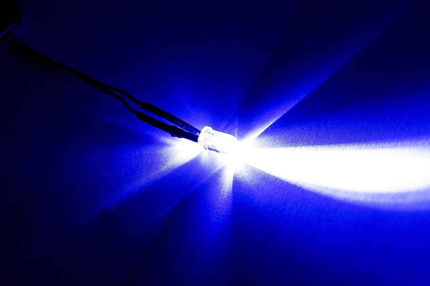 5mm Blue LED - a single, clear-encased light-emitting diode glowing with a bright blue light, attached to two black wires.