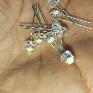 5mm F5 Straw Hat LED White - High Power, Ultra Bright Indicator Light For DIY Projects (0.5W, 3-3.2V) - a close-up shot showing multiple clear, dome-shaped LEDs with metal pins held in a person's palm.