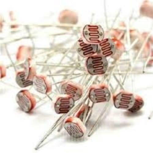 5mm Light Dependent Resistor LDR Sensor - shown as a pile of multiple small, round, beige-colored sensors with visible red serpentine photo-conductive tracks.