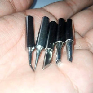 5pcs Lead-free Soldering Iron Tips - shown as a close-up of five varied silver-coloured metal soldering tips held in a person's hand.