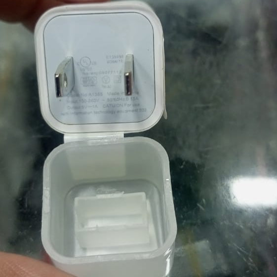 5V 1A Charger Without USB Cable - shown as a white two-piece power adapter with a wall plug and an open rectangular port housing.
