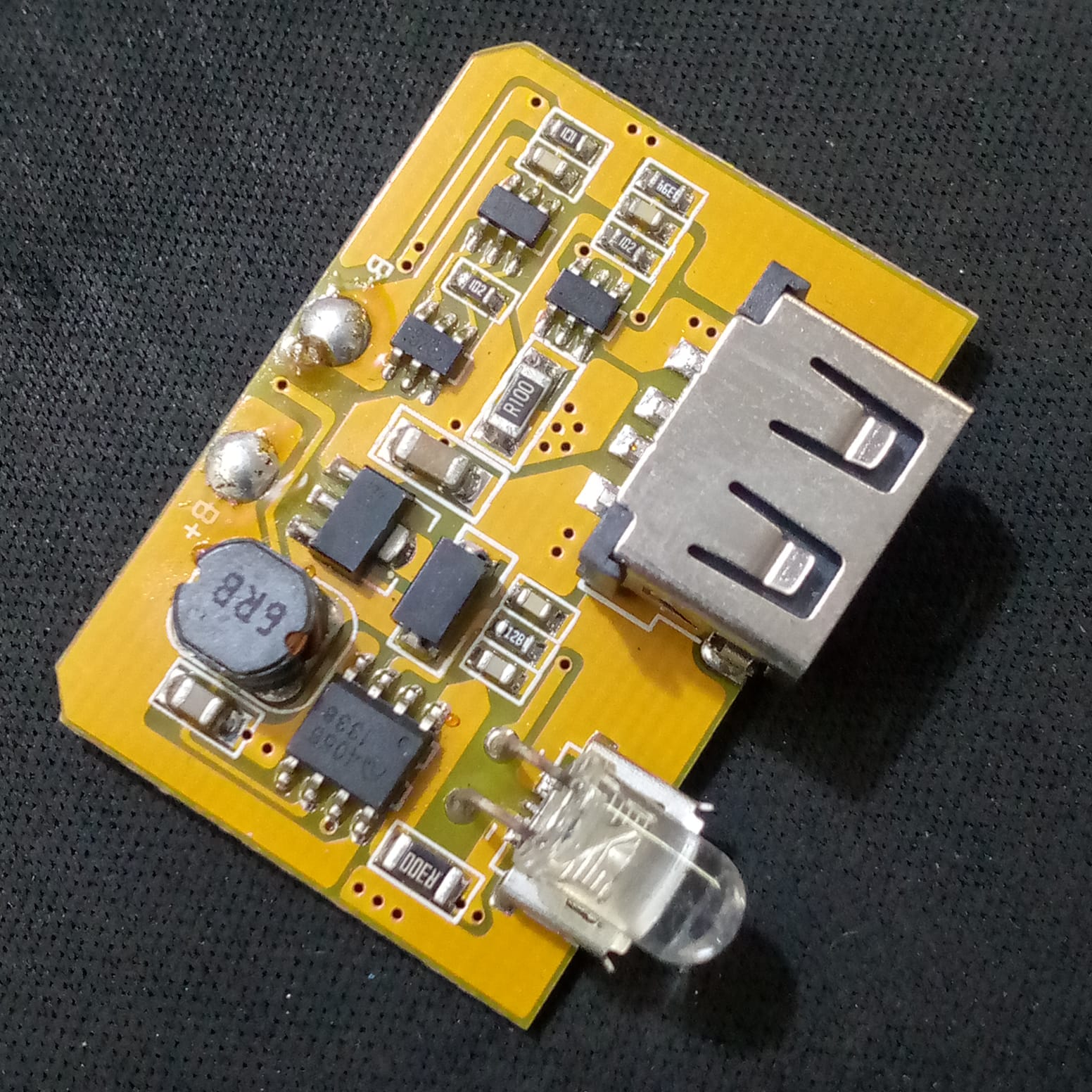 5V 1A Power Bank Charger Step Up Boost Charging Circuit Module - a yellow rectangular circuit board with a USB port, an inductor, and an LED indicator.