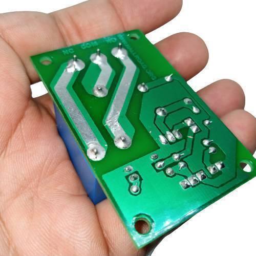5V 30A Relay Module SLA-05VDC-SL-C - shown from the underside, featuring a green circuit board with soldered pins labeled NC, COM, and NO.