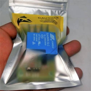 5V 30A Relay Module SLA-05VDC-SL-C - shown inside a sealed, silver static-shielding bag with a yellow caution label.