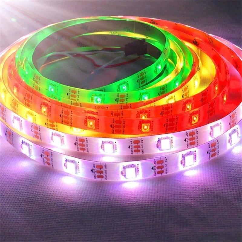 5V 5 Meter Addressable LED Strip WS2812B 30 LED Per Meter - glowing with multi-coloured lights and showing visible 3-pin connectors.