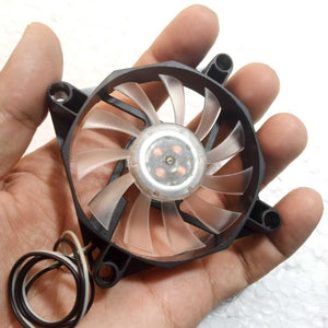 5V Fan With LED - small cooling fan with a black frame, translucent blades, and two black and white wires held in a person's hand.