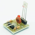 5V Laser Receiver Module High Level Laser Light Detected Sensor Module For Arduino Raspberry Pi - a small circuit board with a laser sensor, a red LED, a brown capacitor labeled 104, two resistors, and a header pin row.