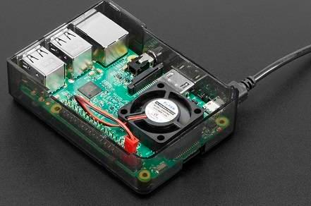 5V Raspberry Pi 4 Fan - installed inside a transparent black plastic case on a Raspberry Pi board with a connected power cable.
