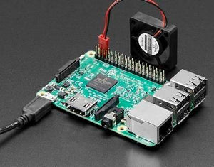 5V Raspberry Pi 4 Fan - shown connected to the GPIO pins of a green Raspberry Pi circuit board with a black cooling fan and a power cable attached.