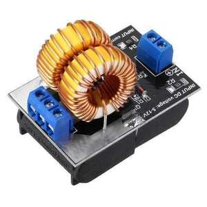 5V To 12V 120W Mini Zvs Induction Heating Power Supply Module With Coil - a black circuit board with two large copper wire coils and two blue screw terminals.