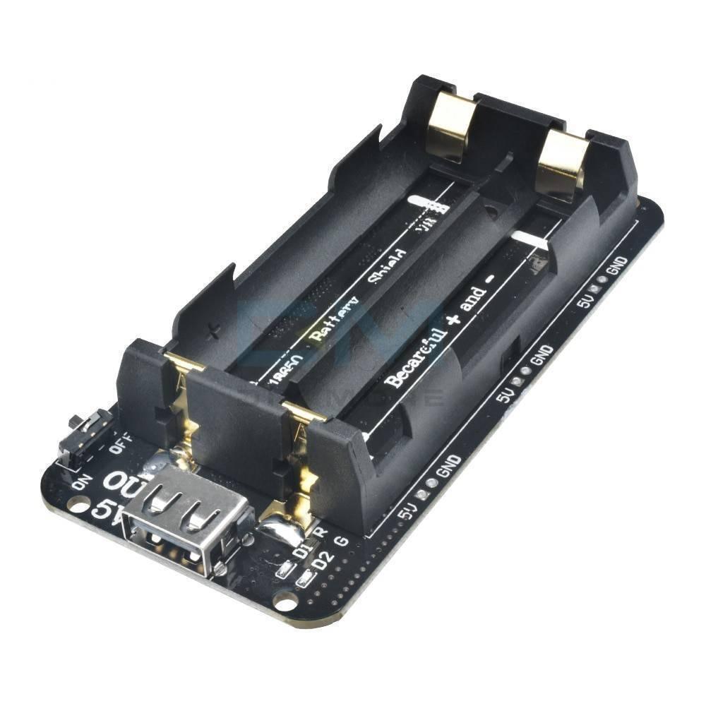5V UPS Arduino Raspberry Pi Battery Shield - a black circuit board with a dual AA battery holder, a USB port, an on/off switch, and LED indicators.
