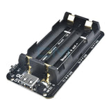 5V UPS Arduino Raspberry Pi Battery Shield - a black circuit board with a dual AA battery holder, a USB port, an on/off switch, and LED indicators.
