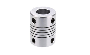 5x10mm Flexible Shaft | High-Quality Rotary Extension | Digilog.pk - silver-coloured cylindrical metal coupling featuring a central flexible spiral section and four small black set screws.