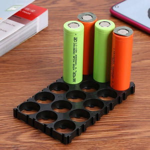 5x3 15 Cell 18650 Battery Spacer Radiating Holder Bracket With Lock For Electric Car Bike - with four 18650 lithium-ion batteries inserted into the black plastic grid.