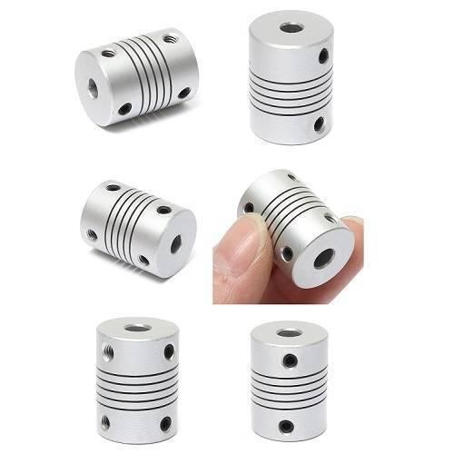 5x6mm Flexible Coupling Shaft With 25mm Outer Diameter - shown in multiple angles and held by a hand, featuring a silver cylindrical body with grooves.