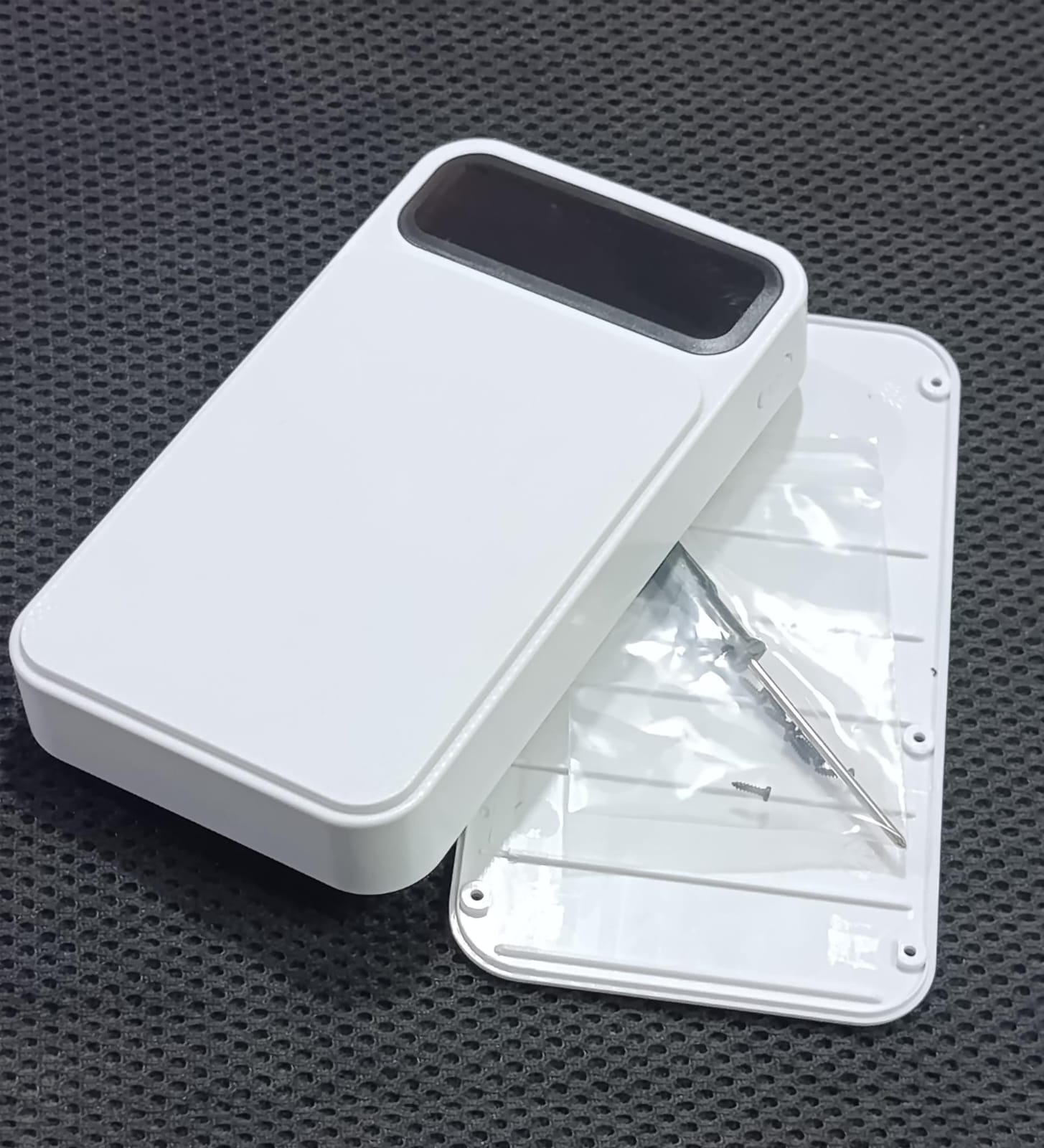 6 Cell Power Bank Battery Case 18650 X Battery Charger Box - a white rectangular case with a black display area and a separate back cover with screws.