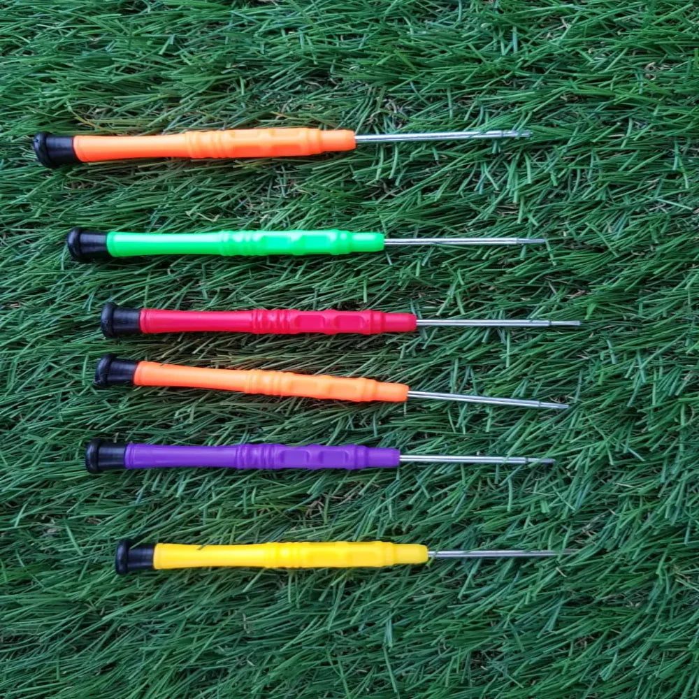 6 in 1 Repair Opening Tool Kit Screwdriver Set P-3001 for Phone & Electronics - six multi-coloured precision screwdrivers laid out horizontally on a green grass background.