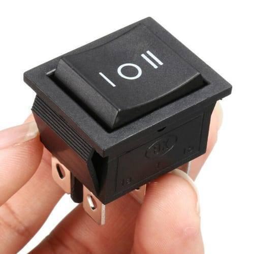 6 Pin 3 Position Dpdt Rocker Switch On Off On Power Button Switch - a black rectangular three-position power button held in a hand, showing the top rocker with I, O, II markings.