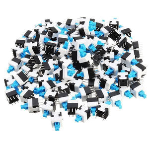 6 Pin Push Lock Button 7x7 PCB Mount Dpdt Switch - shown as a large pile of individual white and black plastic switches with blue push-button actuators.