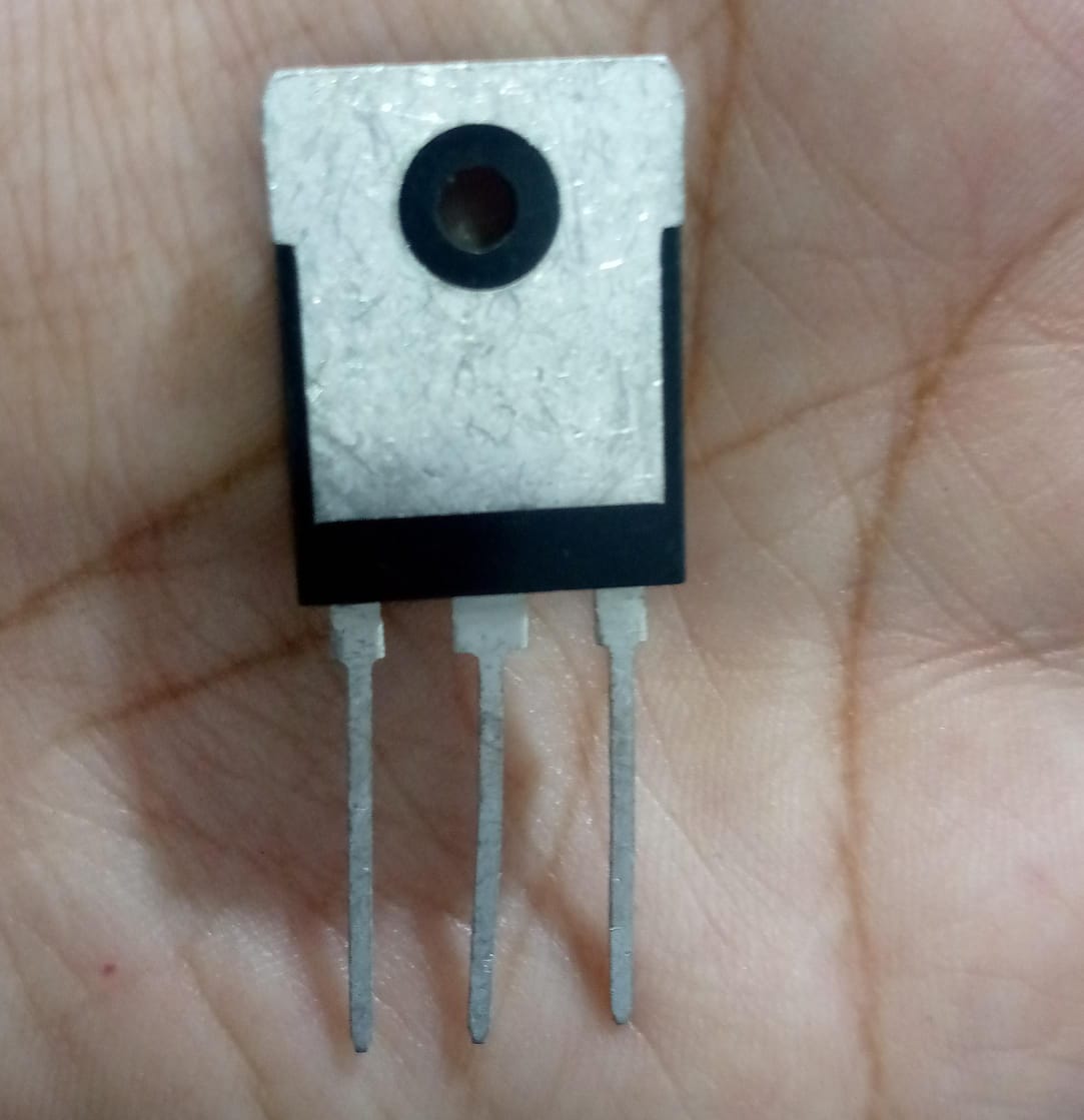 60N60FD1 MOSFET - 600V 60A N-channel Power Transistor - a black and silver three-pin electronic power transistor component held against a person's palm.