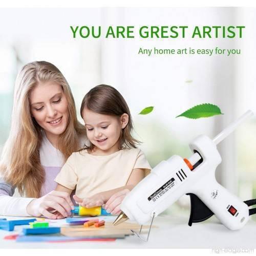 60W-100W Dual Temperature Hot Melt Glue Gun - shown in white with a red power switch, resting on a table next to a mother and child crafting.