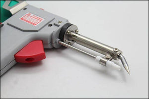 60W Manual Automatic Tin Welding Gun 941-60 Soldering Gun - a close-up view of the grey plastic soldering gun featuring a red trigger and a metal heating element tip.